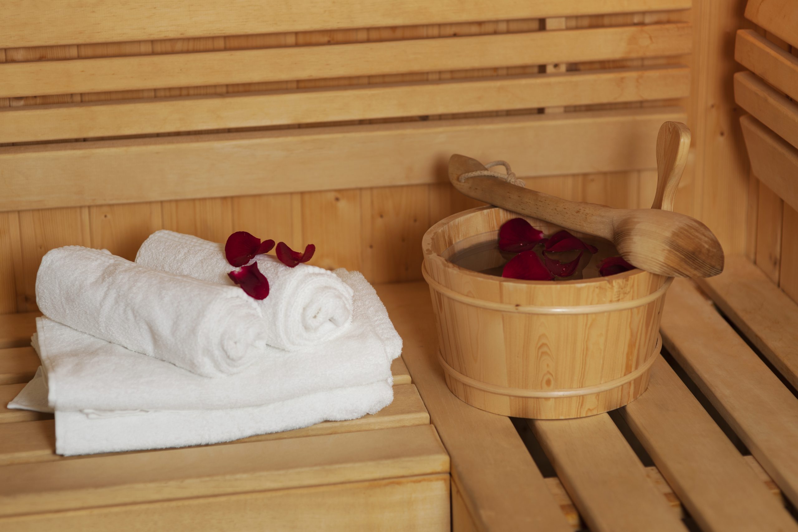 Sauna bucket with rose petals