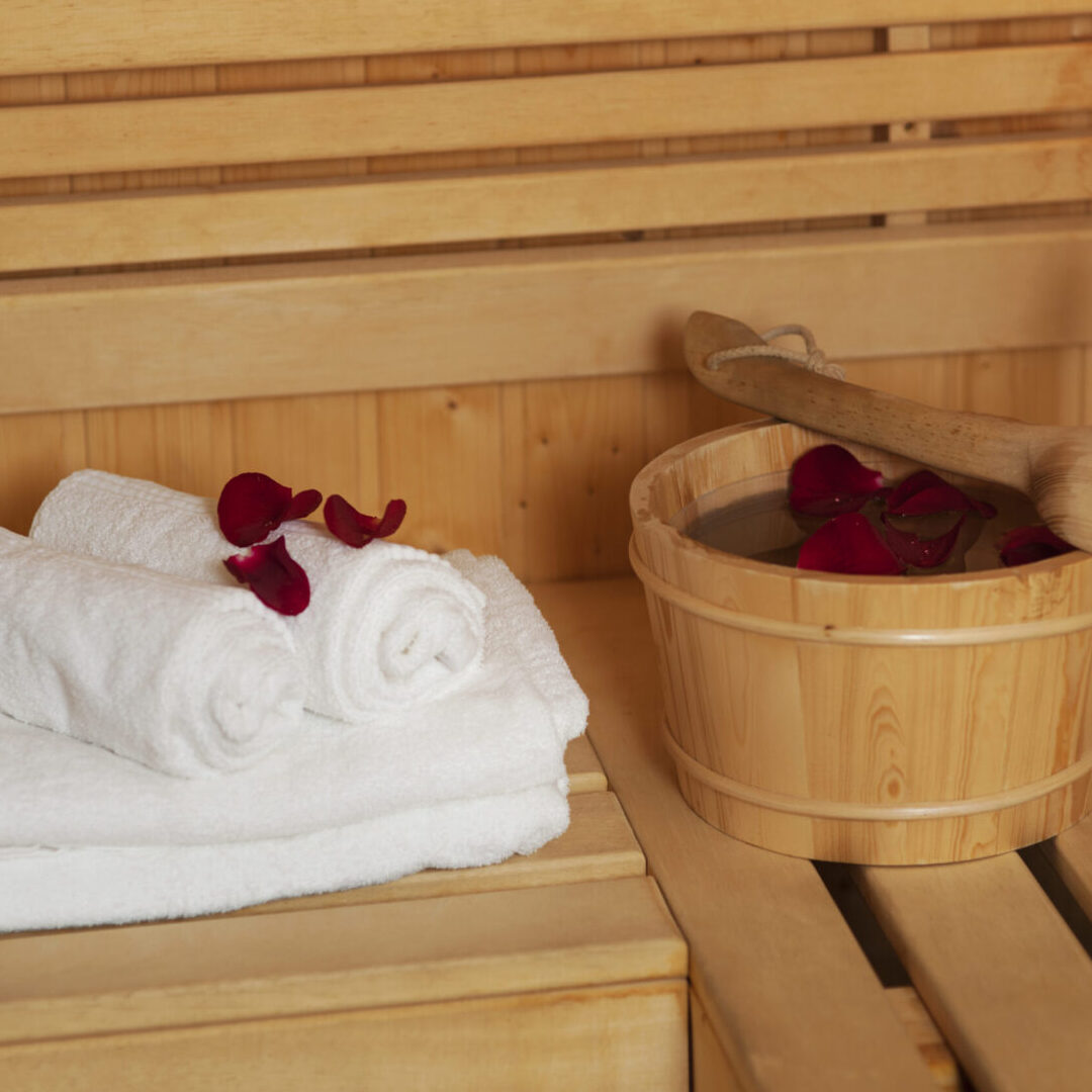 Sauna bucket with rose petals